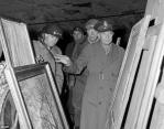 General Dwight D. Eisenhower (right) inspects some of the stolen art found in a salt mine in Merkers, Germany